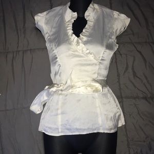 Cream color blouse size xxs.